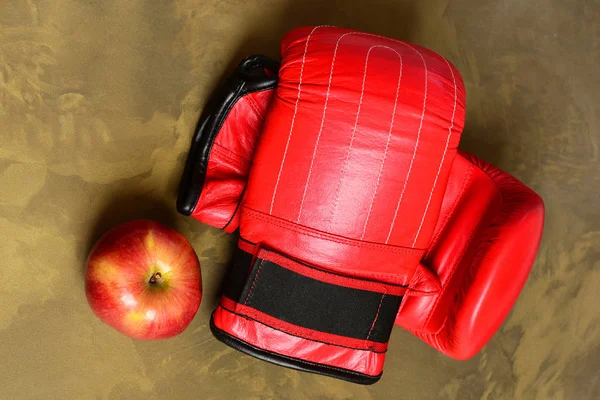 Boxing gloves in red color. Pair of leather boxing sportswear