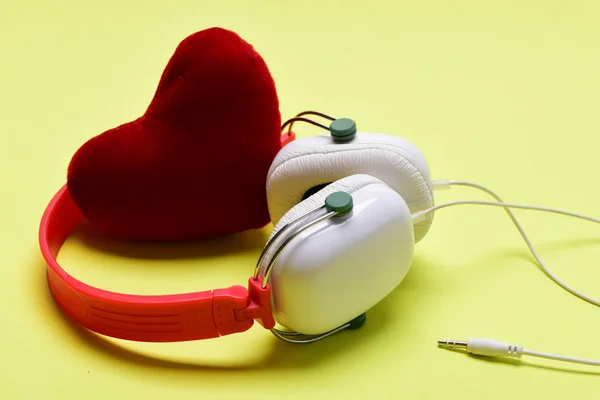 Headset for music with love symbol. Headphones in white, red