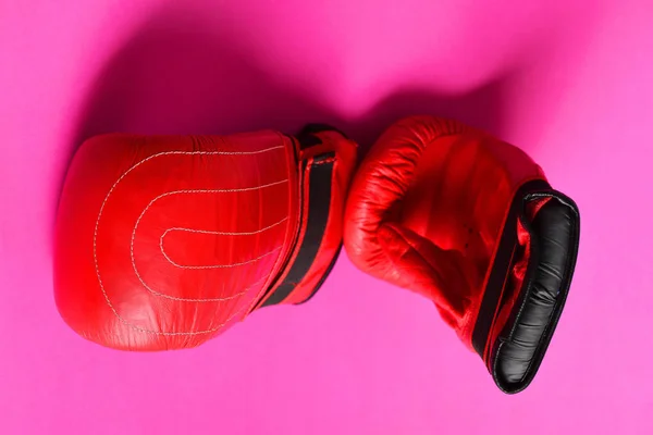 Idea of healthy sport habit. Red boxing gloves on pink — Stock Photo, Image