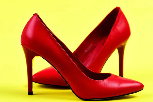 Formal high heel shoes on yellow background — Stock Photo, Image