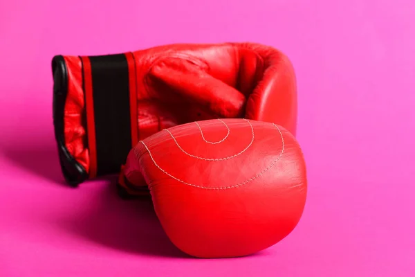 Sport gloves for boxing in red color isolated on pink