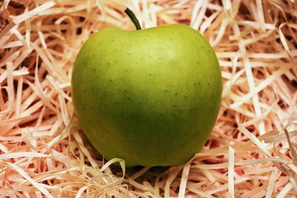 apple on wood chips background