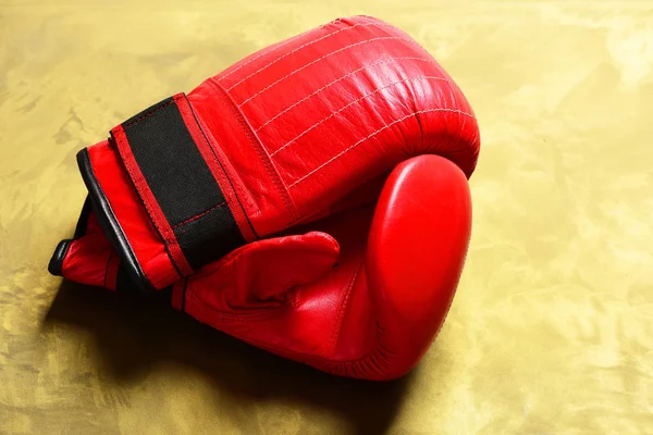 Boxing gloves in red color. Professional box and strong fight