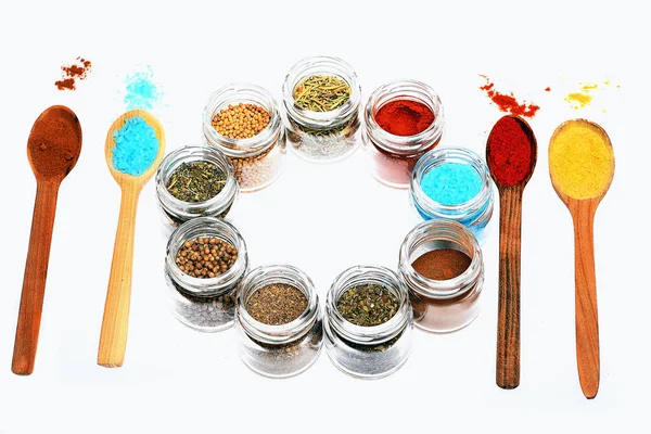 Various spices in spoons and jars on white background — Stock Photo, Image