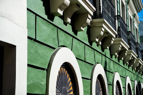 Facade wall on green plastered background in San Juan, Puerto Rico