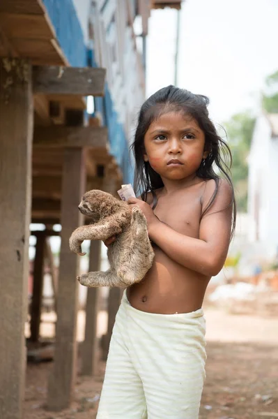 Girl child selling sloth in village — Stock Photo, Image