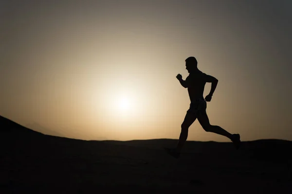 Silhouette or man runner, guy running outdoor at clear sky — Stock Photo, Image