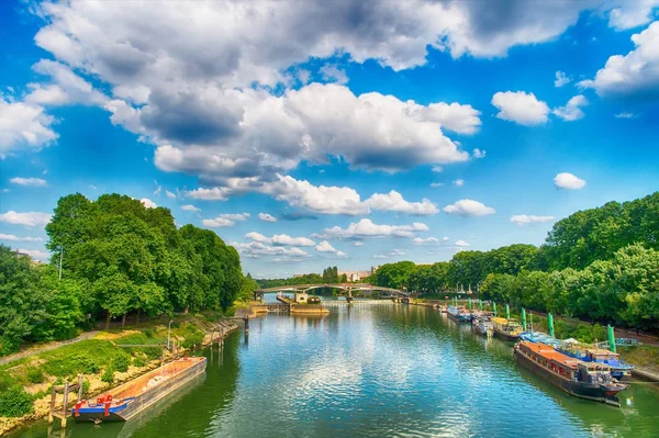 River and bridge in Paris, France on sunny day