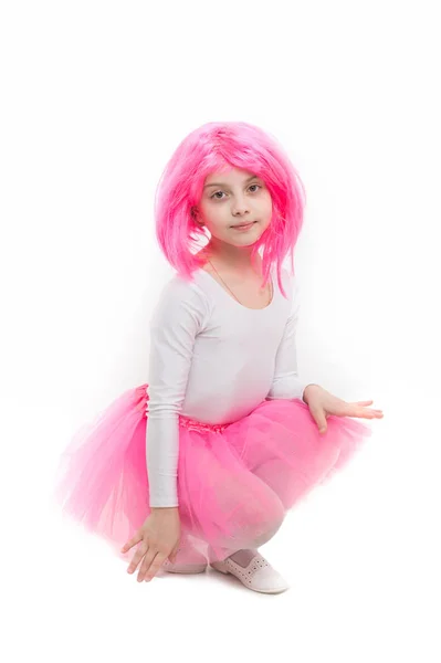 Ballet and art. Small girl t in pink skirt. Child in wig isolated on white background. beauty and fashion. Childhood and happiness. — Stock Photo, Image