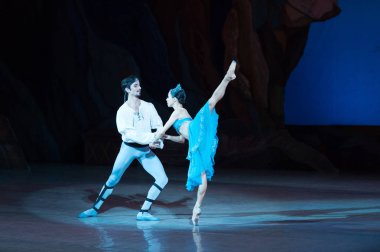 ballet dancers Aleksandr Stoyanov and Katerina Kukhar dancing during ballet Corsar clipart