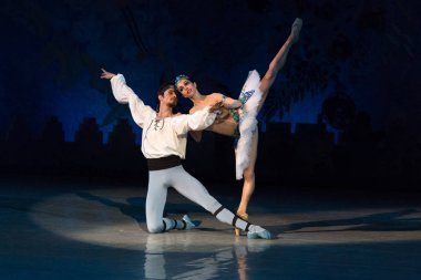 ballet dancers Aleksandr Stoyanov and Katerina Kukhar dancing during ballet Corsar clipart