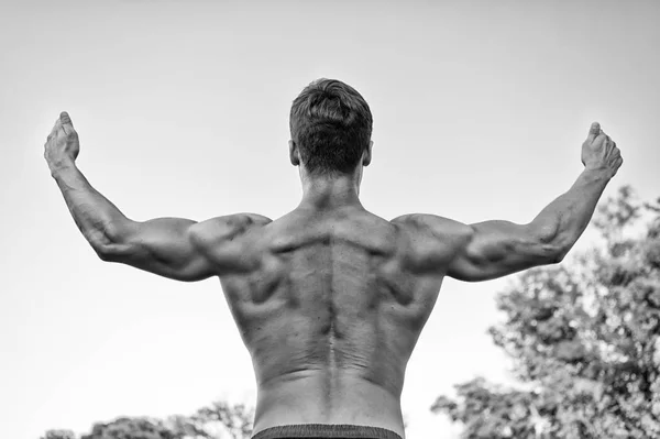 Sportsman or man raising arms, back view — Stock Photo, Image