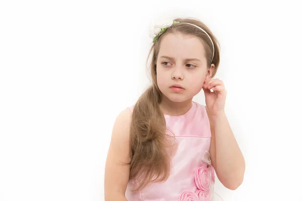 Girl with long blond hair fix earring in pink dress — Stock Photo, Image