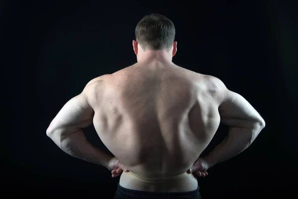 Man with muscular body and back.