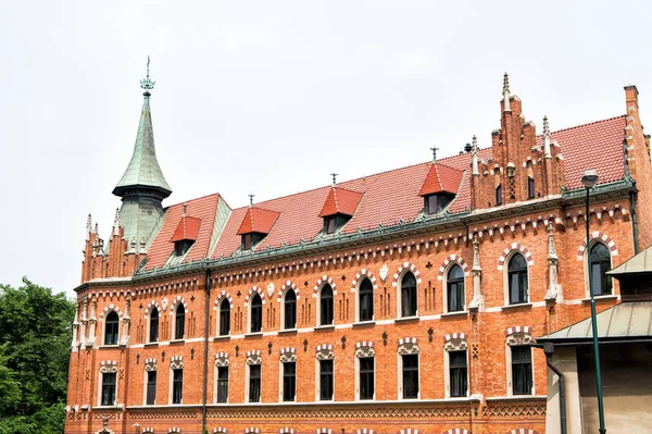 Building of red brick in krakow, poland — Stock Photo, Image