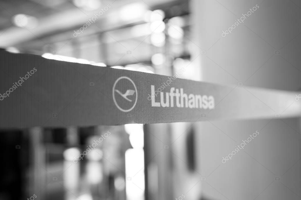 Frankfurt am Main, Germany - October 11, 2015: Lufthansa icon or logo sign on blue tape or ribbon with airlines symbol on blurred background