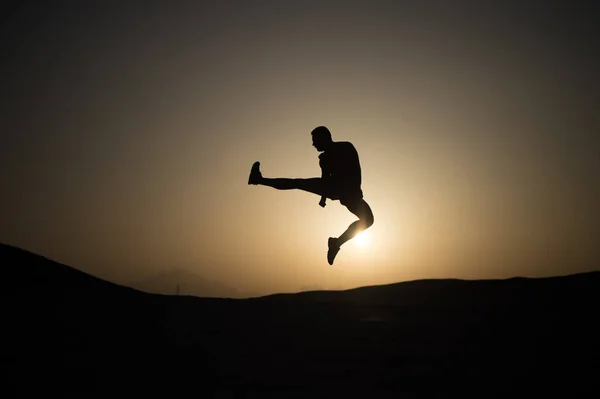 Silhouette of sportsman — Stock Photo, Image