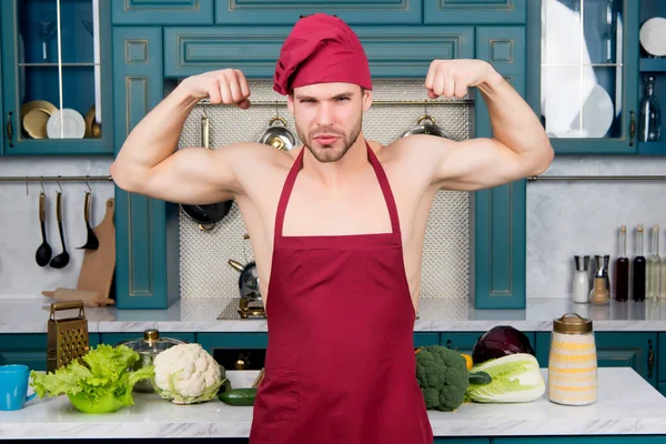 Man chef in apron on sexy torso show biceps, triceps