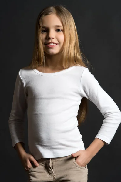 Kid girl with long hair in white shirt — Stock Photo, Image