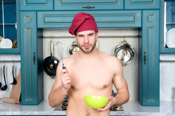 Guy with sexy torso hold metal whisk and bowl — Stock Photo, Image