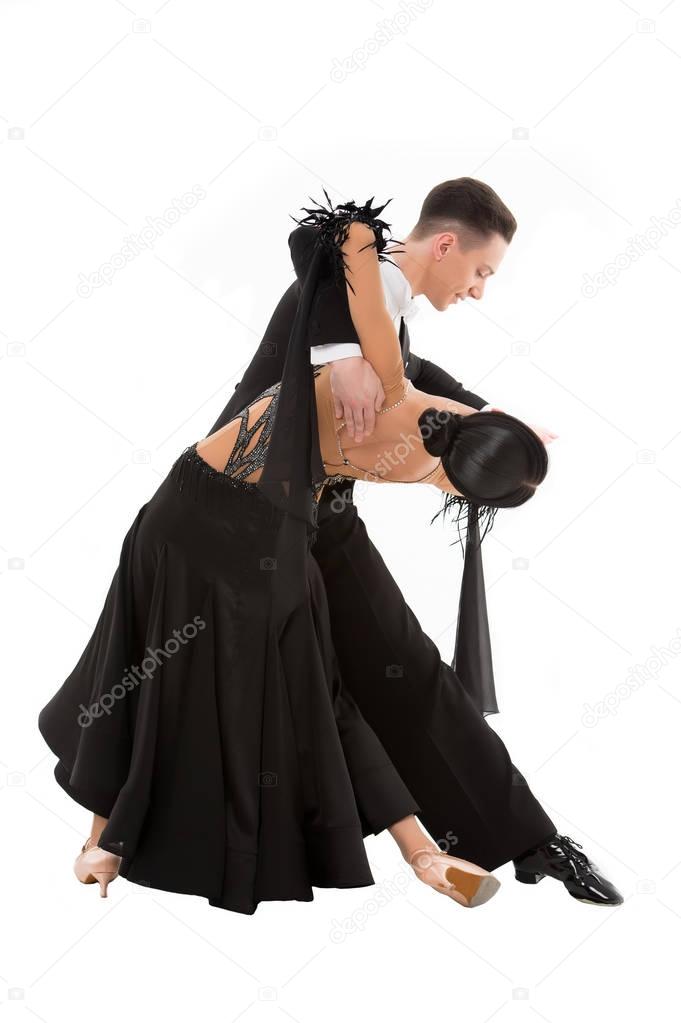 ballroom dance couple in a dance pose isolated on white background. ballroom sensual proffessional dancers dancing walz, tango, slowfox and quickstep