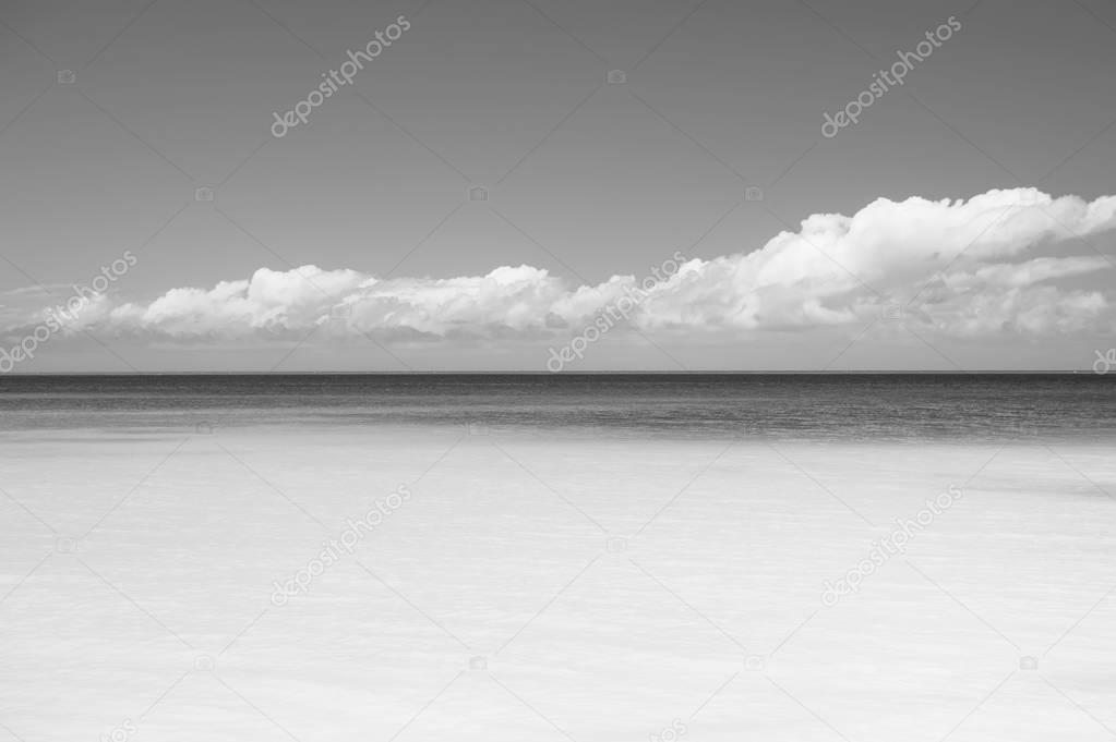 Beautiful marine view on caribbean sea coast line with clean wavy surf ocean water on sandy beach at sunny day as natural background with blue sky, st. john, Antigua