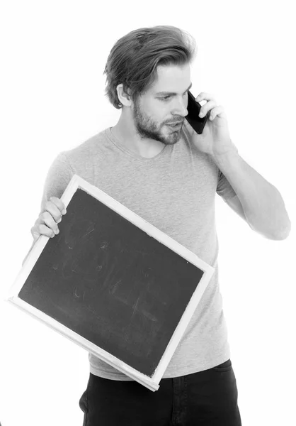 Man with smartphone and blackboard — Stock Photo, Image