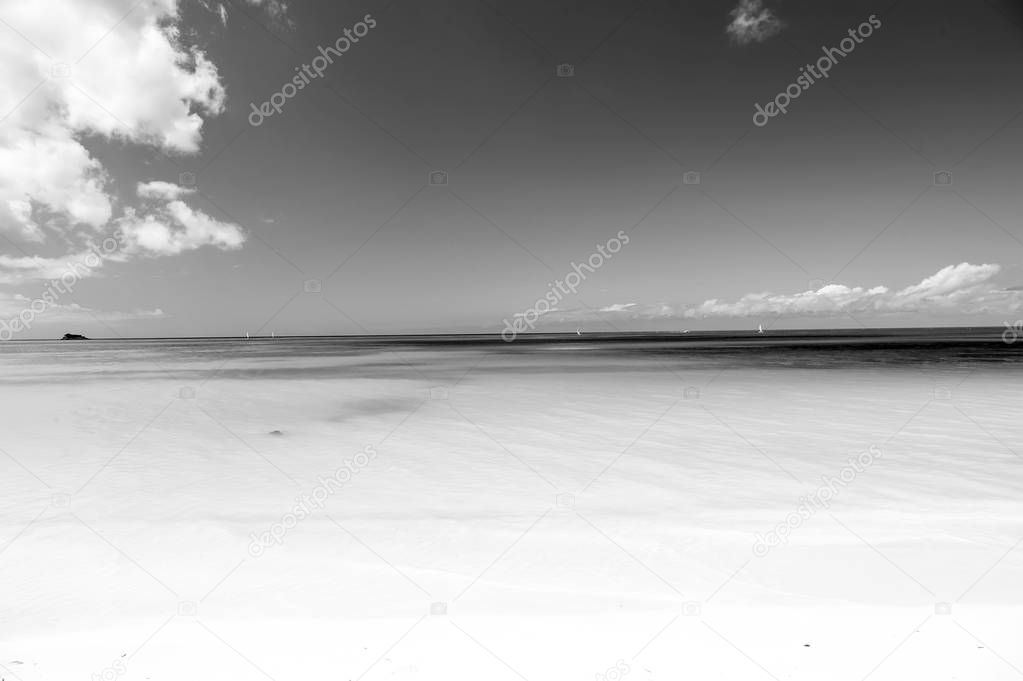 wavy sea, ocean water background on sand coast in Antigua