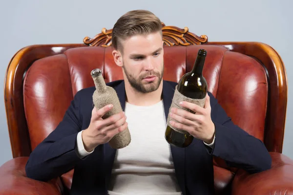 Guy choose wine to drink, choice