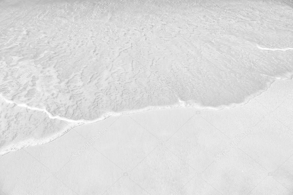 wavy sea, ocean water background on sand coast in Antigua