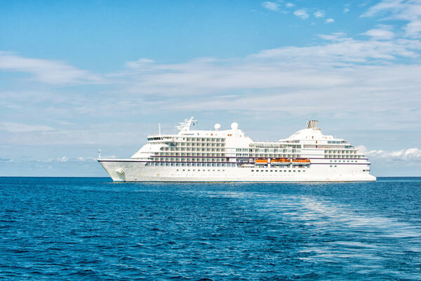 Ship in sea in great stirrup cay, bahamas. Ocean liner on blue seascape. Water transport, vessel. Adventure, discovery, journey. Summer vacation, wanderlust