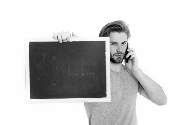 Blackboard in hand of man with mobile phone — Stock Photo, Image