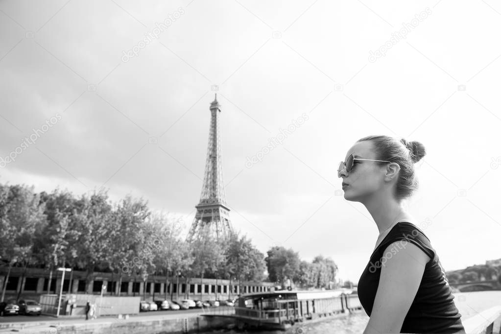 girl looking at eiffel tower in Paris, France