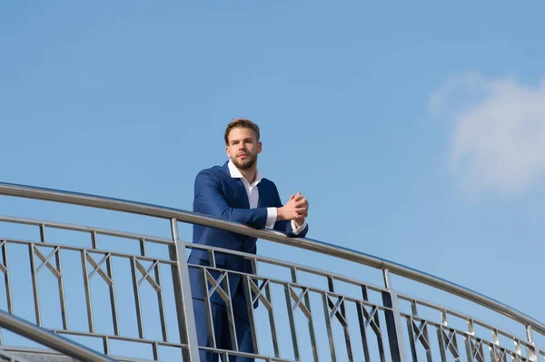 Career, success and future concept. Bearded man on blue sky. Manager in business suit outdoor. Businessman on sunny day. Business fashion, style and dress code, copy space