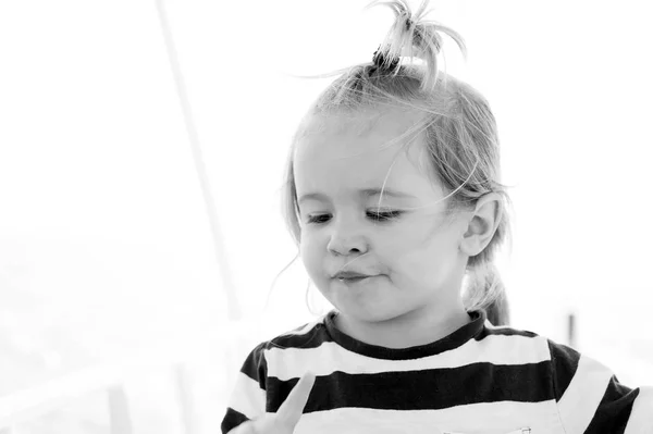 Baby boy with blond hair ponytail in sailor shirt — Stock Photo, Image