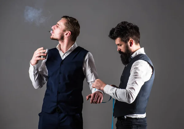 Client on arrogant face smoke cigar and hold glass — Stock Photo, Image