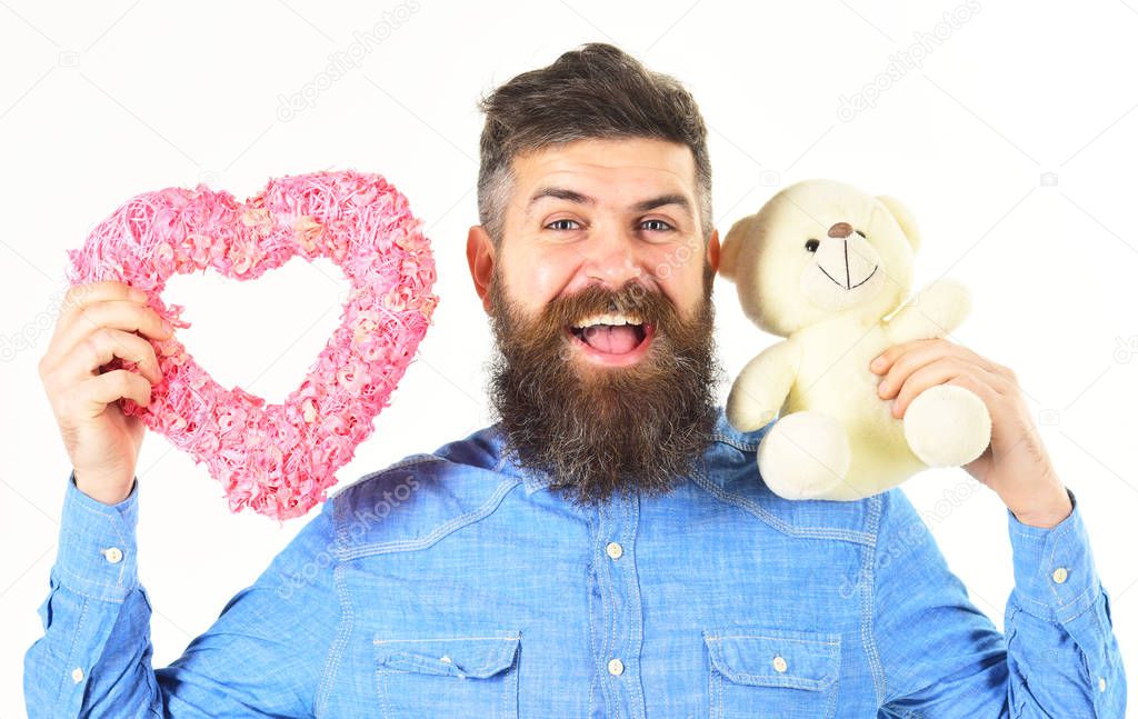 Mature man with romantic gifts isolated on white background.