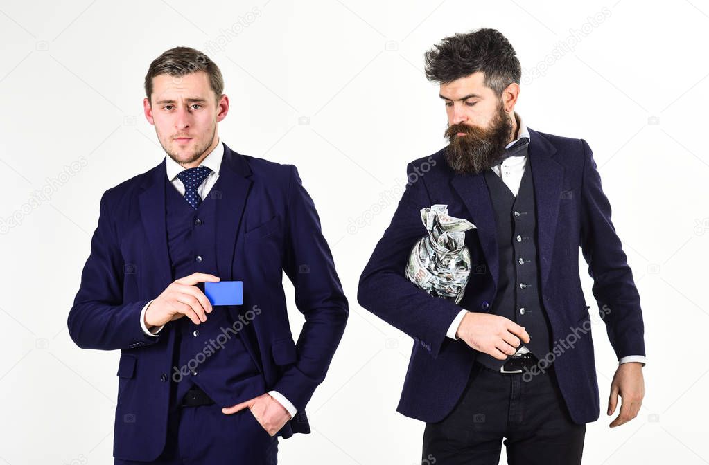 Mature man prefers cash, modern guy recommends credit card, electronic money, copy space. Crypto currency concept. Men in suit, businessmen with jar full of cash and credit card, white background