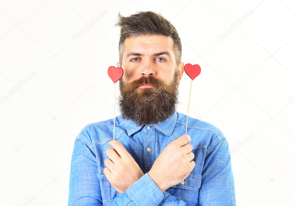 Brutal man with long beard and red hearts.