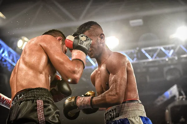 An unidentified boxers in the ring during fight for ranking points — Stock Photo, Image