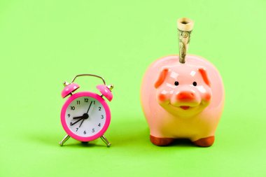 It is time to pay. Piggy bank stuffed dollar cash and alarm clock. Financial crisis. Banking account. Bankruptcy and debt. Pay for debt. Bank collector service. Credit debt. Economics and finance clipart