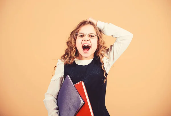 Shocked small girl wants to be teacher. small girl with paper folder. hometwork. notebook for diary notes. study lesson. knowledge and education. Back to school. Expect something extra — Stock Photo, Image
