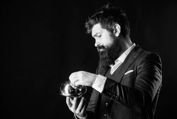 Man well groomed gentleman formal suit hold little cloche. Serving and presentation. Elite luxurious. Secret under cloche. Exclusive food hidden cloche. What is under cloche. Waiter luxury restaurant