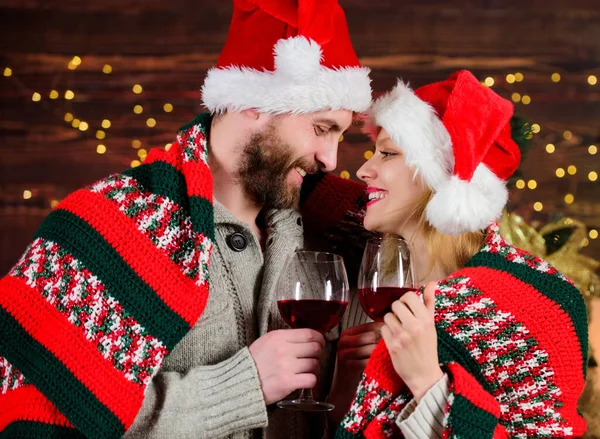 marry me. merry christmas. Family drink wine. couple in love santa hat. Time for presents. greeting time. Couple feeling cozy. woman and man love xmas. happy new year. Holiday celebration