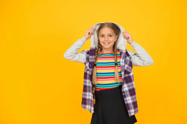 Hairdresser salon. Little girl. Small child with cute braids hairstyle on yellow background. Child care concept. Preteen girl colorful clothes. Childrens shop store mall. Adorable girl beautiful face — Stock Photo, Image