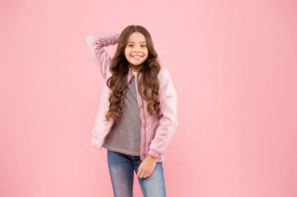 Fall trends. Autumn season collection. Street style outfit. Comfortable outfit for autumn. Trendy outfit. Little kid wear pink bomber jacket. Fashion girl. Modern fashion for kids. Clothes store — Stock Photo, Image