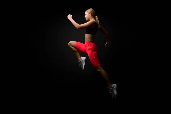 Life is motion. Woman athlete run achieve great result. How run faster. Speed training guide. Improve run speed. Girl runner on black background. Sport lifestyle and health concept. Start run — Stock Photo, Image