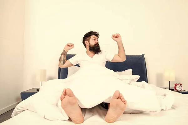 Enjoying nice morning. energy and tiredness. asleep and awake. brutal sleepy man in bedroom. bearded man hipster sleep in morning. mature male with beard in pajama on bed. Morning inspiration