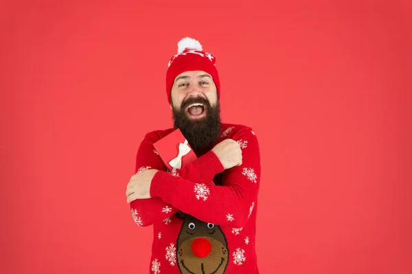 Celebrating New Year. bearded man after shopping. man hipster in hat. winter holidays. his favorite sweater. merry christmas. got xmas gift. seasonal discounts. present from santa. happy new year — Stock Photo, Image