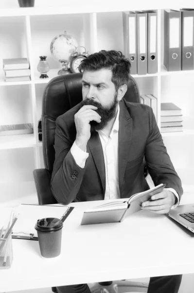 Busy boss in office. Check if i have time today. Man bearded hipster boss sit in leather armchair office interior. Boss at workplace. Manager formal clothing corporate style working. Business people — Stock Photo, Image